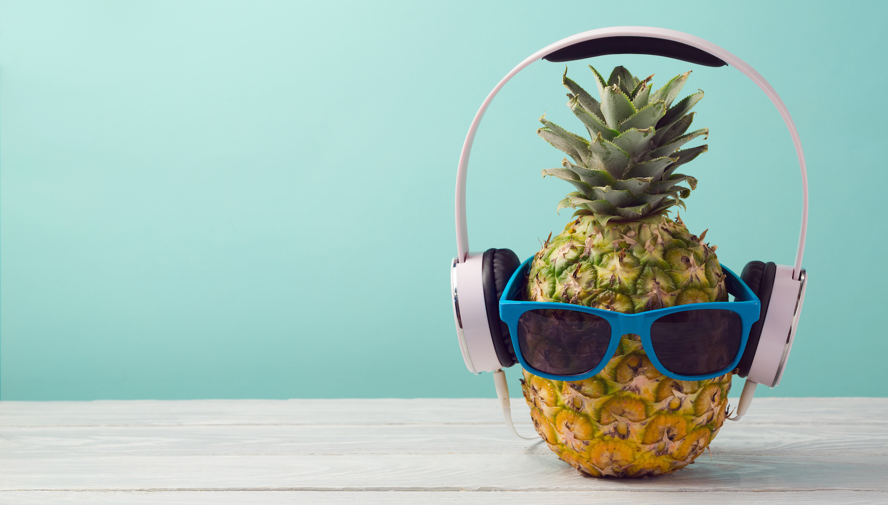Pineapple with headphones and sunglasses