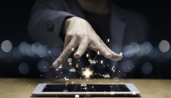 Businessman hand create artificial intelligence for technology transformation and internet of thing on tablet. Cloud technology will management big data include business strategy , customer service.